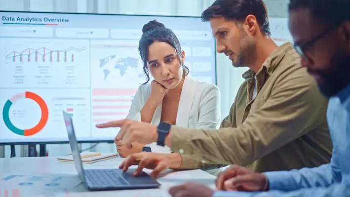 Team discussing advertising on social media platforms