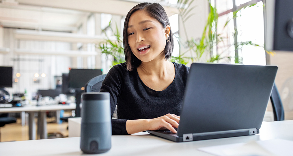 Person speaking to smart speaker to order products online