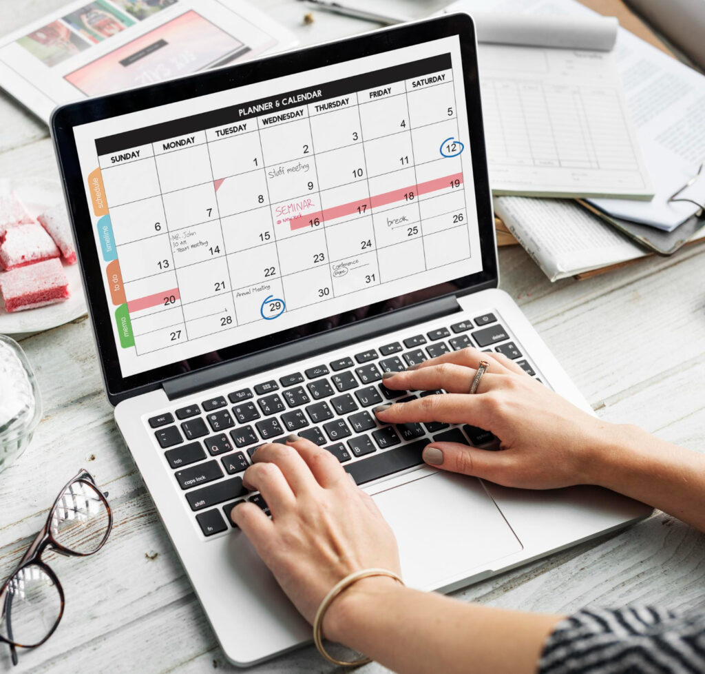 Blogger planning a content calendar on a laptop